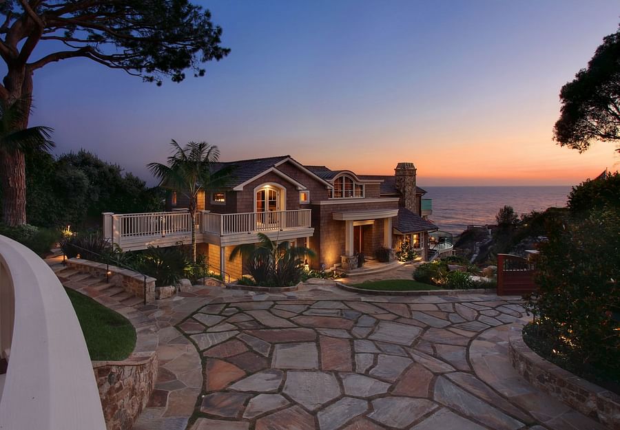 Luxurious mansion bathed in the glow of a sunset