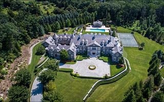 What are the annual costs associated with owning a 10,000 square foot mansion?